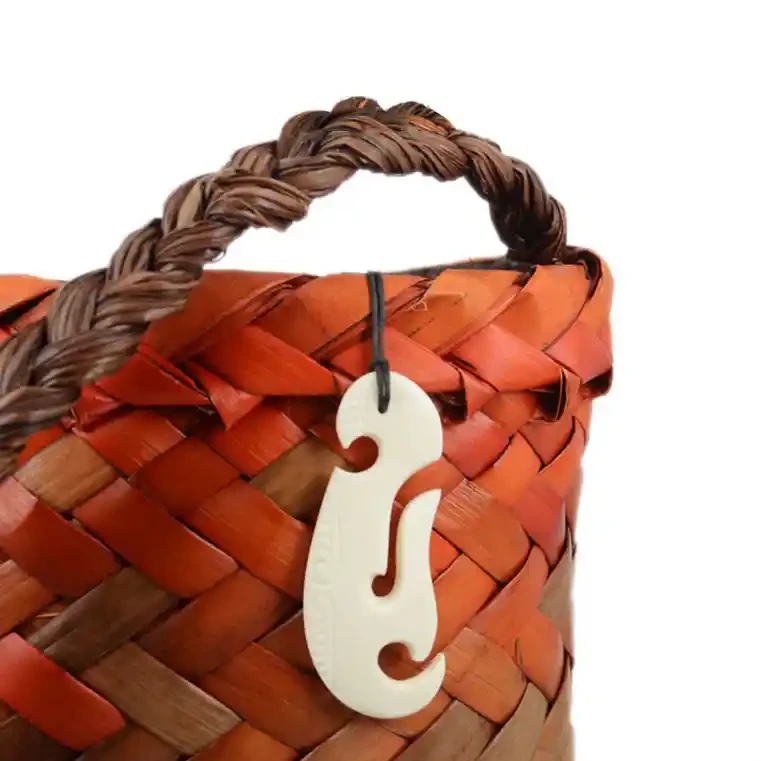 Contemporary fishhook bone carving