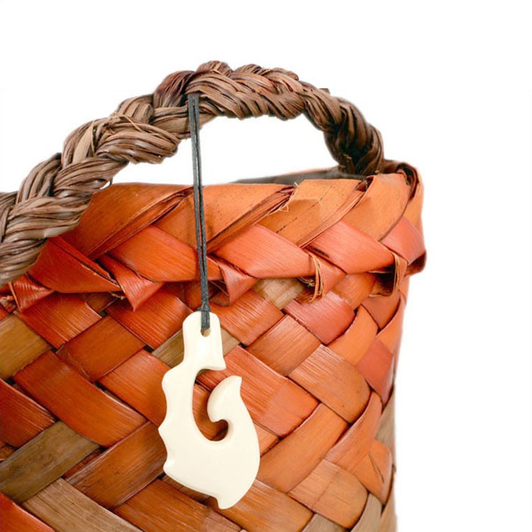 Small Māori fishhook bone carvings