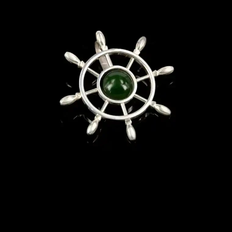 Silver steering wheel with greenstone centre