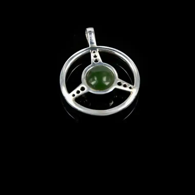 Silver car steering wheel with greenstone