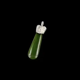Jade mere pendant with silver warrior mask