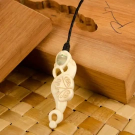 Manaia bone carving Taranaki style