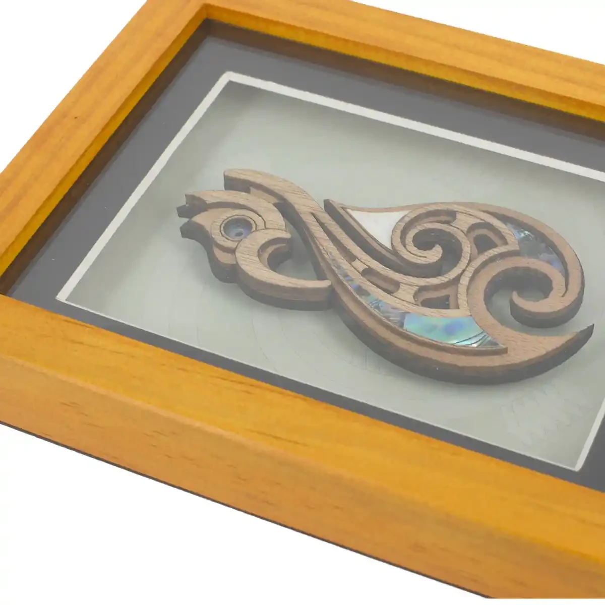 Medium framed Māori fishhook carving
