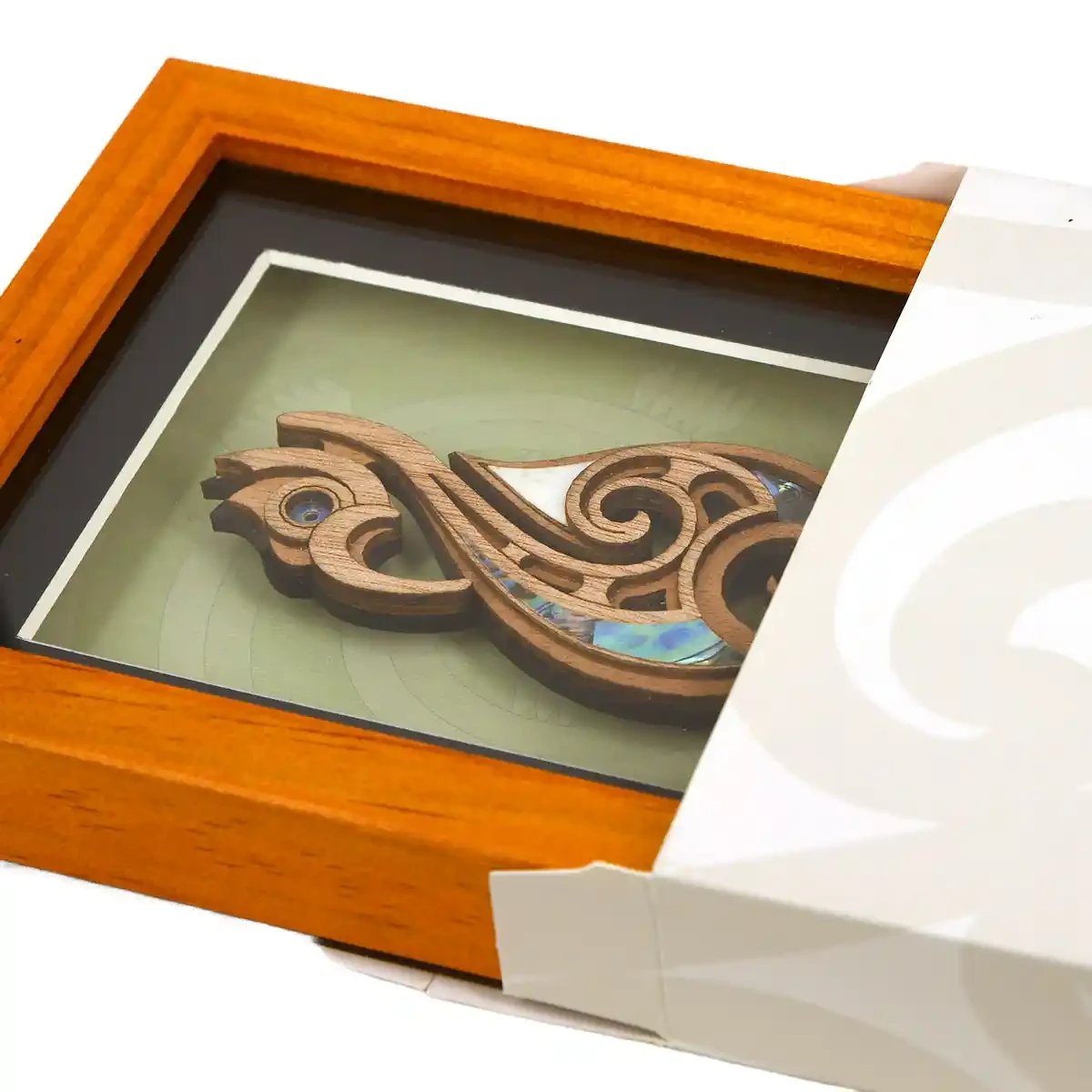 Medium framed Māori fishhook carving