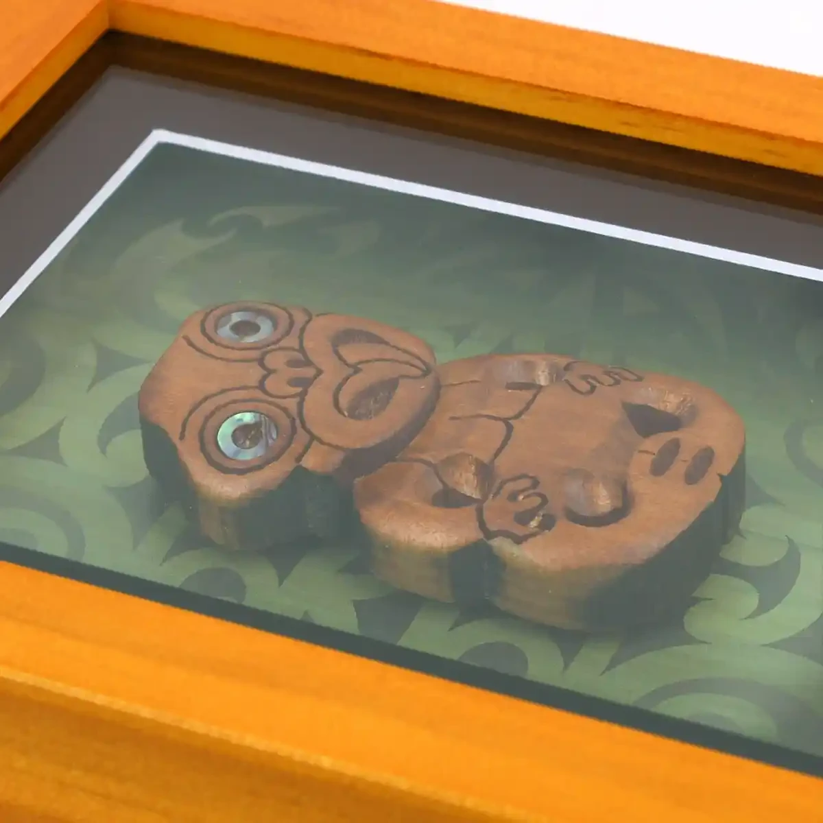 Contemporary Māori art. Framed Māori tiki, kauri. Small.