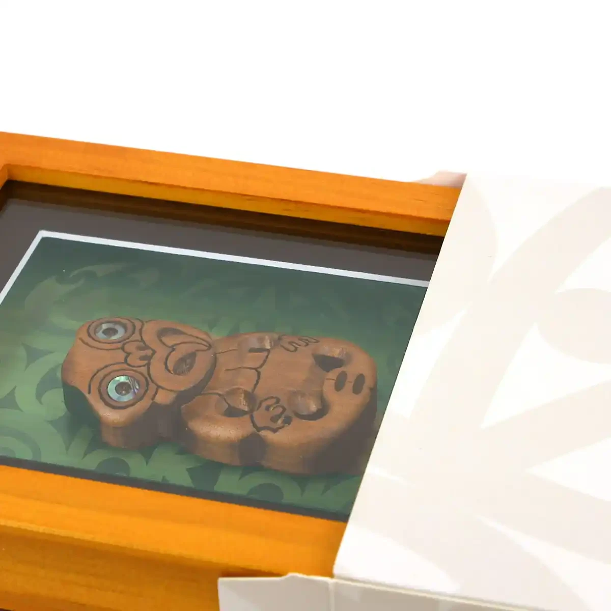 Contemporary Māori art. Framed Māori tiki, kauri. Small.