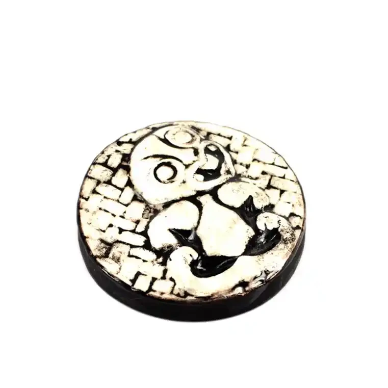 Round ceramic tiki decoration