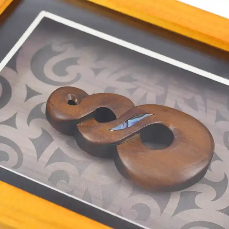Framed Māori twist carving