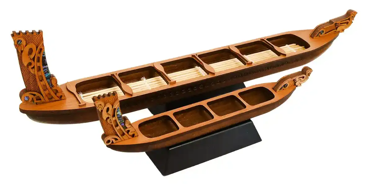 Small and medium Māori waka with pāua inlay