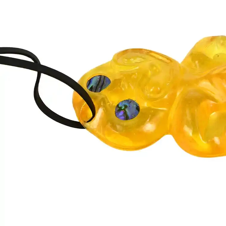 Glass tiki. Glass Māori tiki, shiny finish