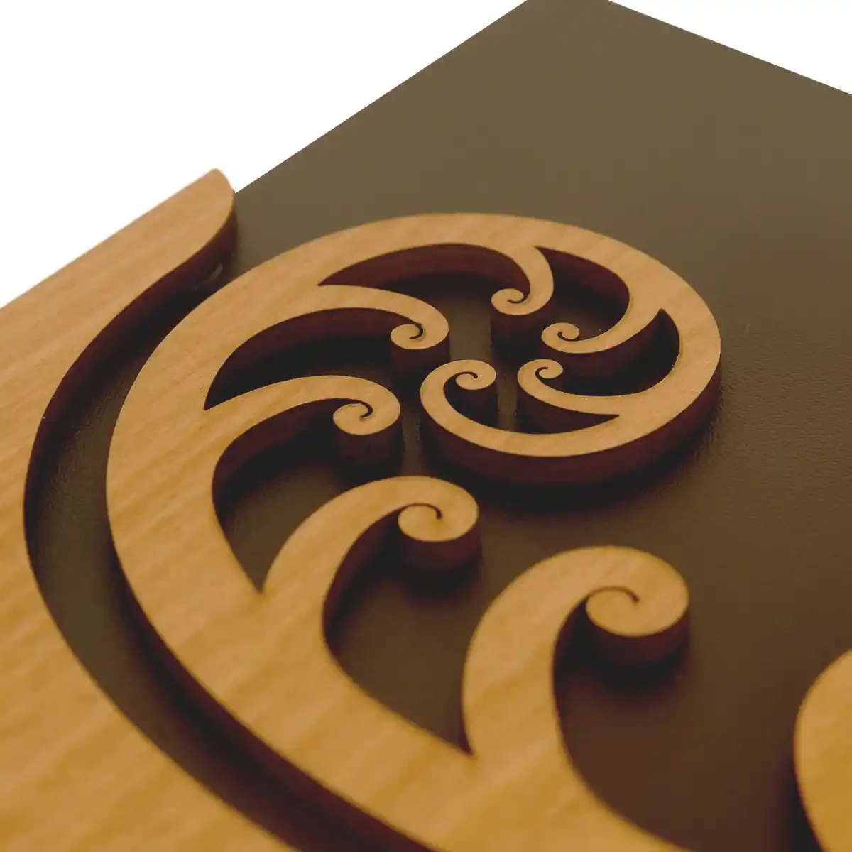 Māori wall art. Koru wall hanger from rimu veneer