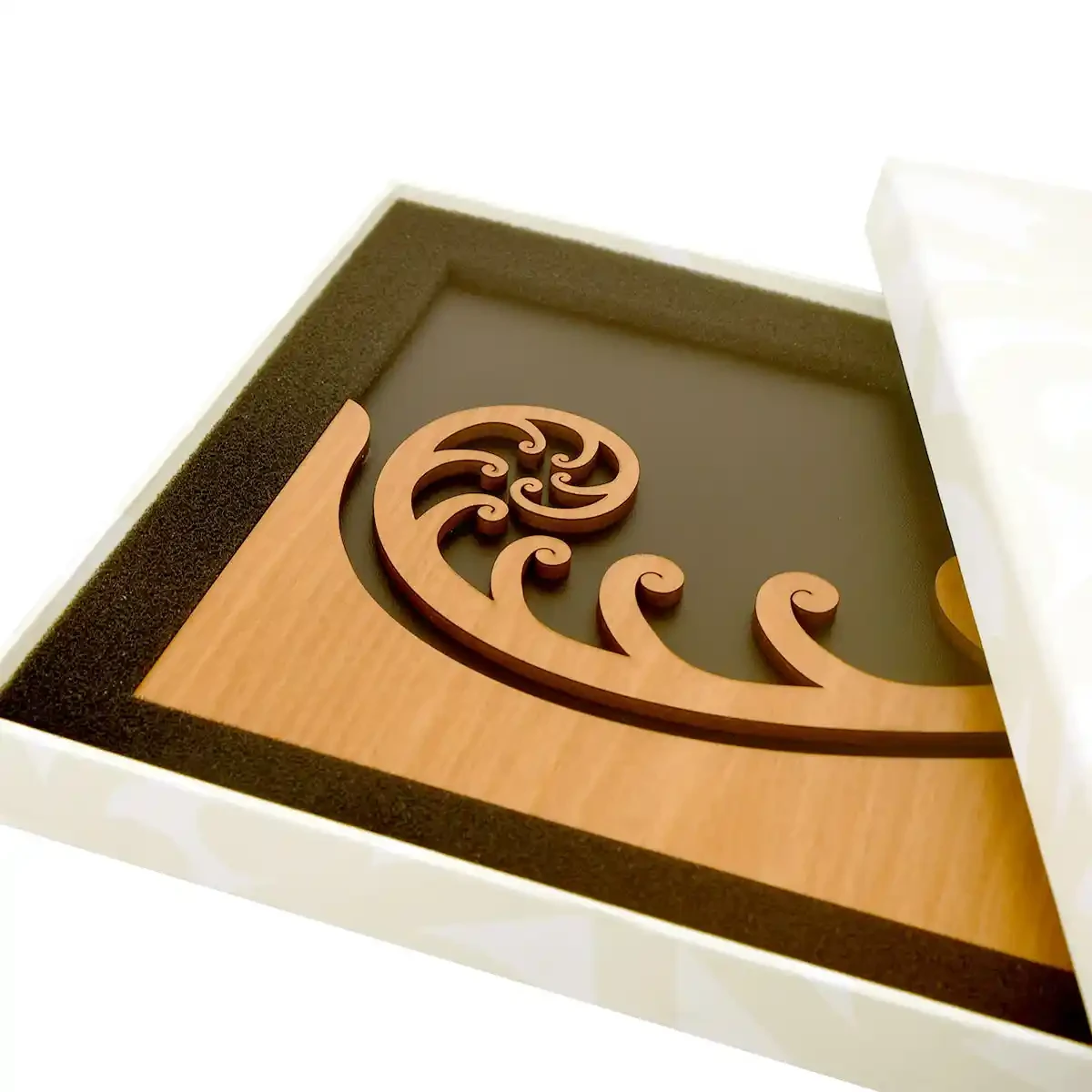 Māori wall art. Koru wall hanger from rimu veneer