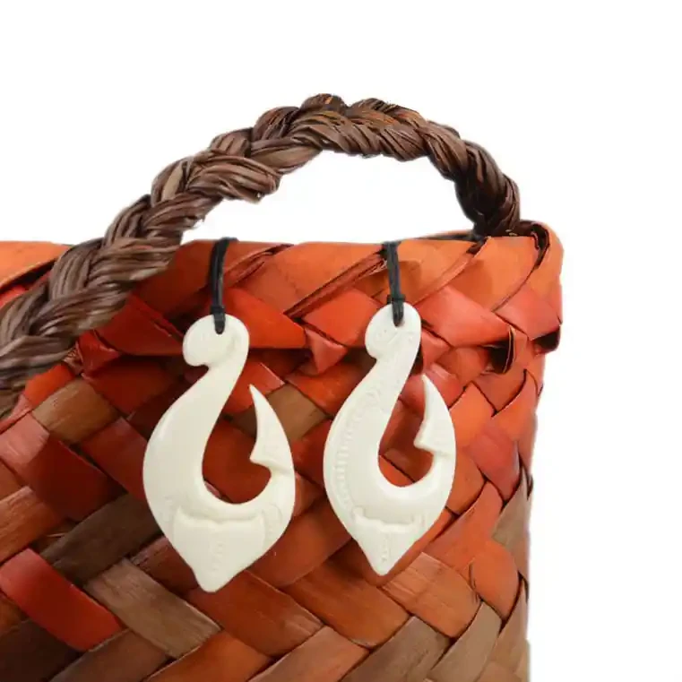 Māori fishhook bone carvings with whale tail