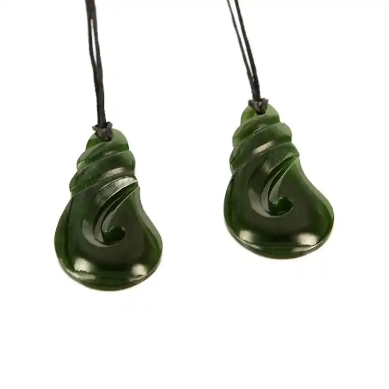 Small greenstone fishhook pendants