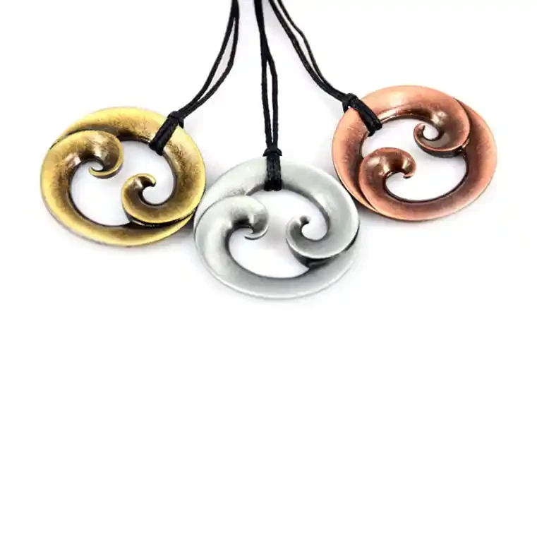 Round double koru zinc pendants