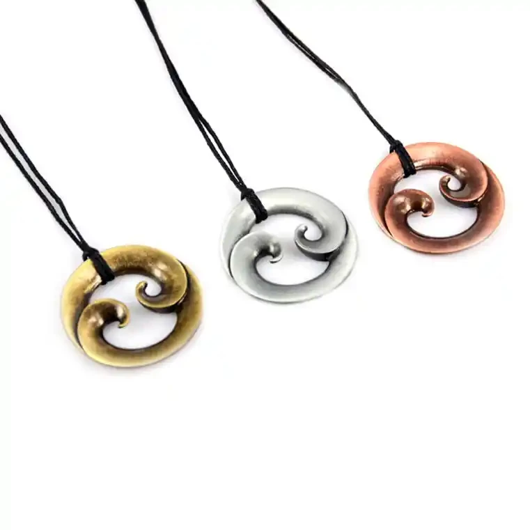 Round double koru zinc pendants