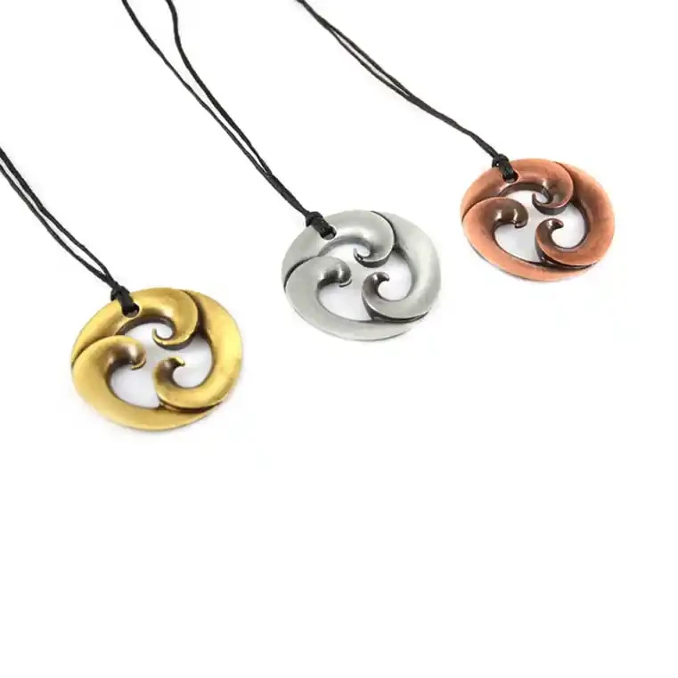 Triple koru zinc pendants.