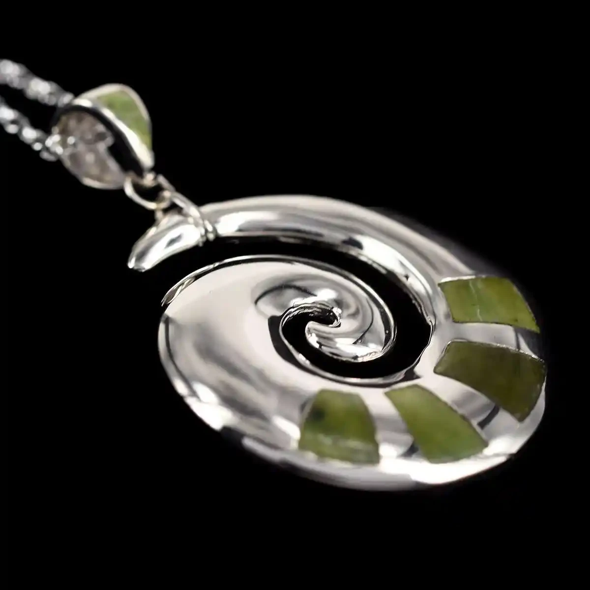 Sterling silver koru pendant with greenstone