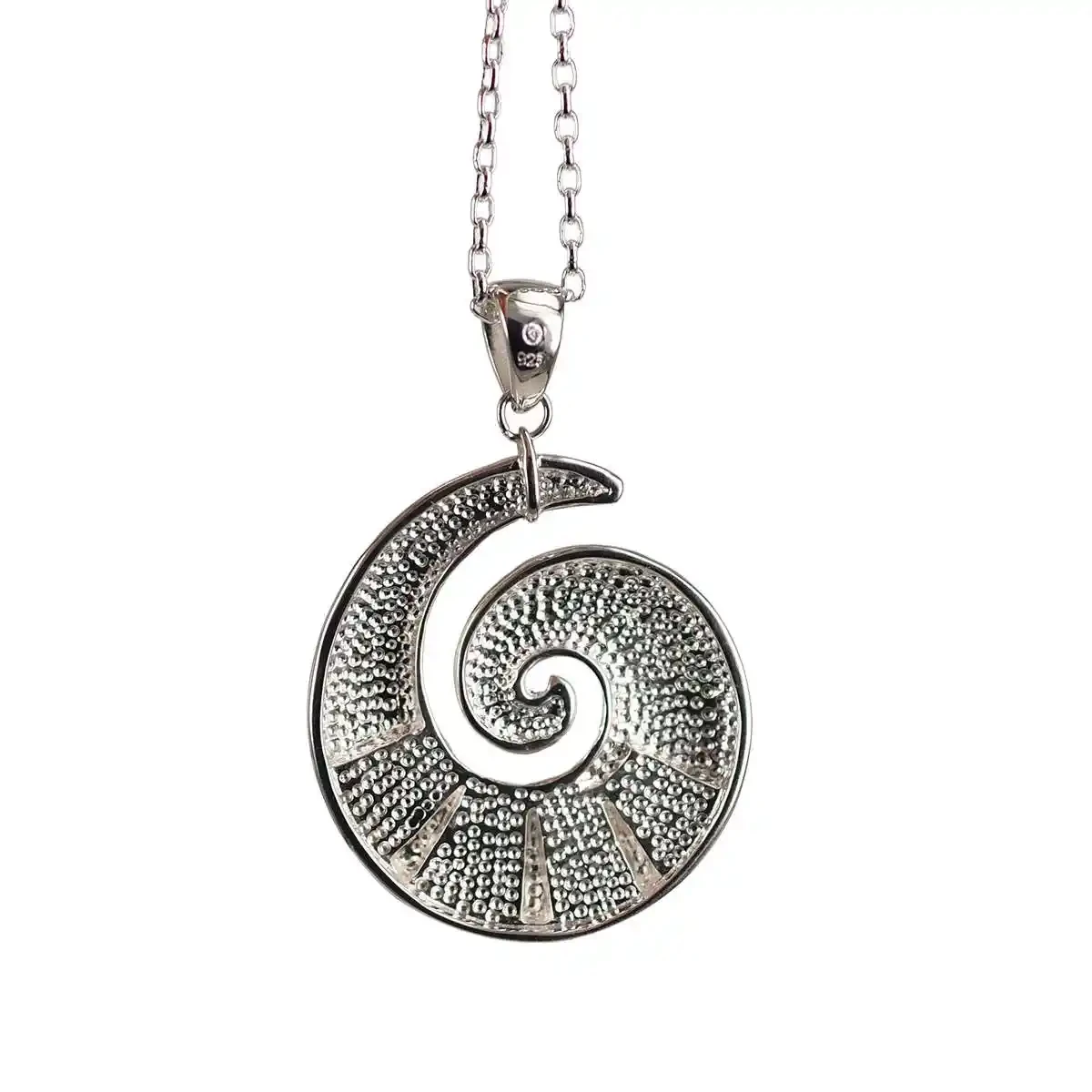 Sterling silver koru pendant with greenstone
