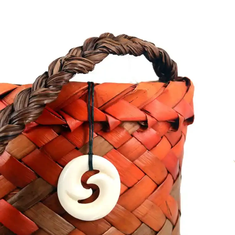 Double inner koru bone carving