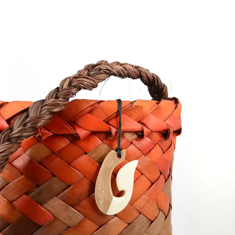 Matau fishhook pendants. Half wood, half bone