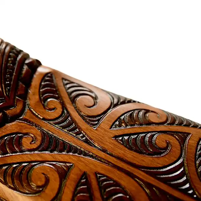 Māori waka hoe, paddle, with koru blade
